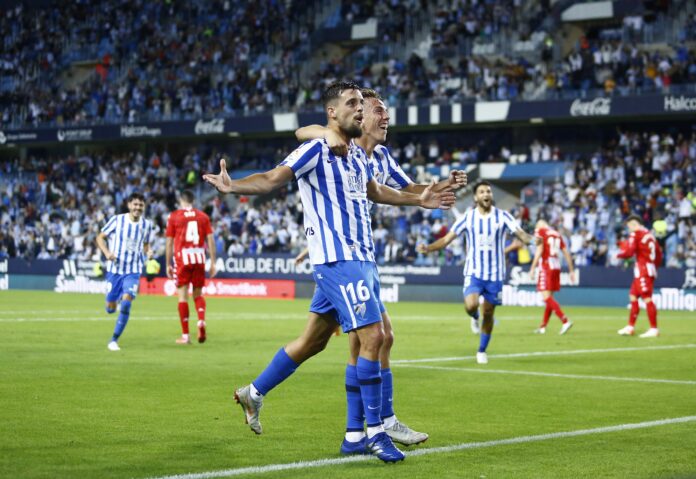 Genaro y Paulino celebran el gol frente al Lugo