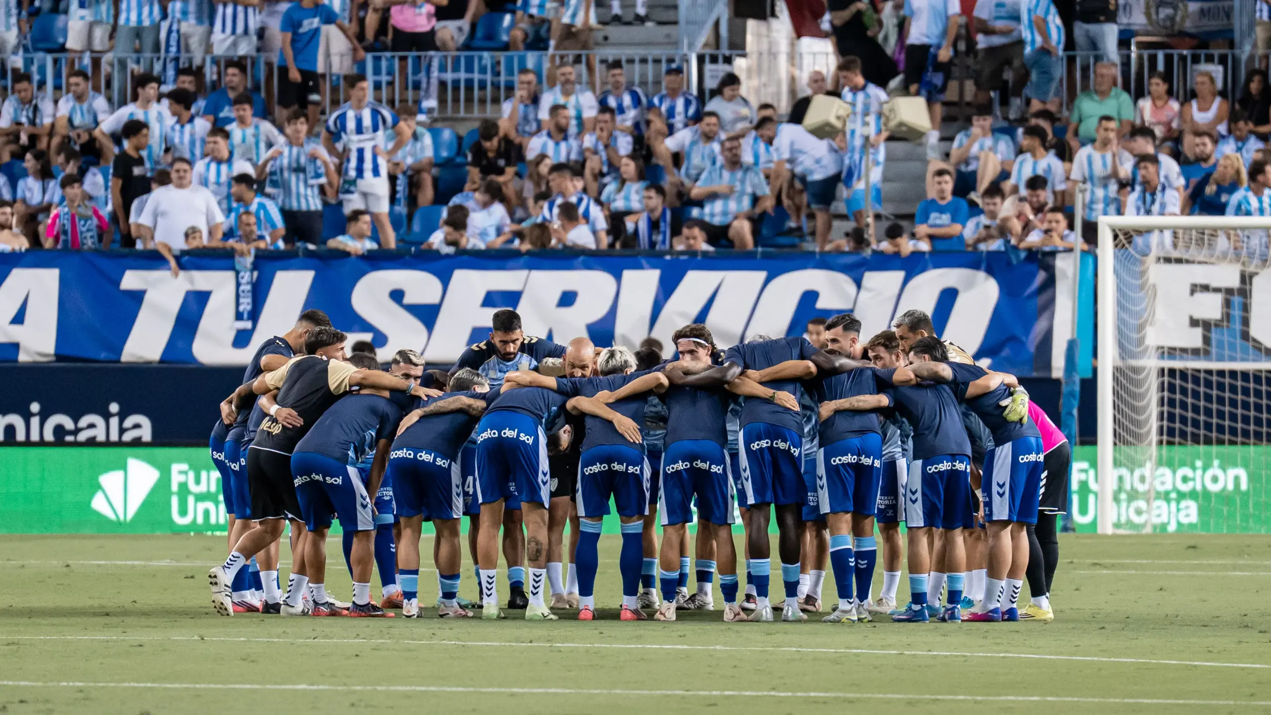 malaga cf deportivo coruna la rosaleda jornada 2 pina conjura calentamiento once alineacion scaled